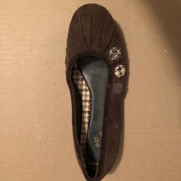 Brown button flats